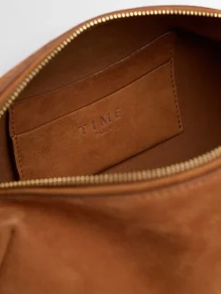 Elongated suede shoulder bag