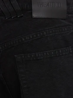 Jeans ampi in tela washed con cutout