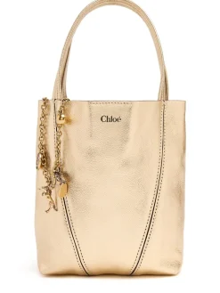 Spin metallic leather top handle bag