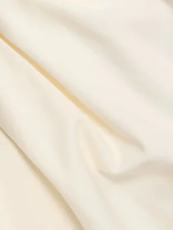 Top asimmetrico in cotone drappeggiato