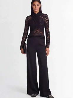 Top collo alto in pizzo stretch